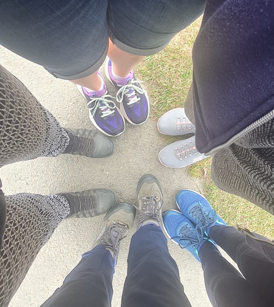 Walking group participants standing together in a circle